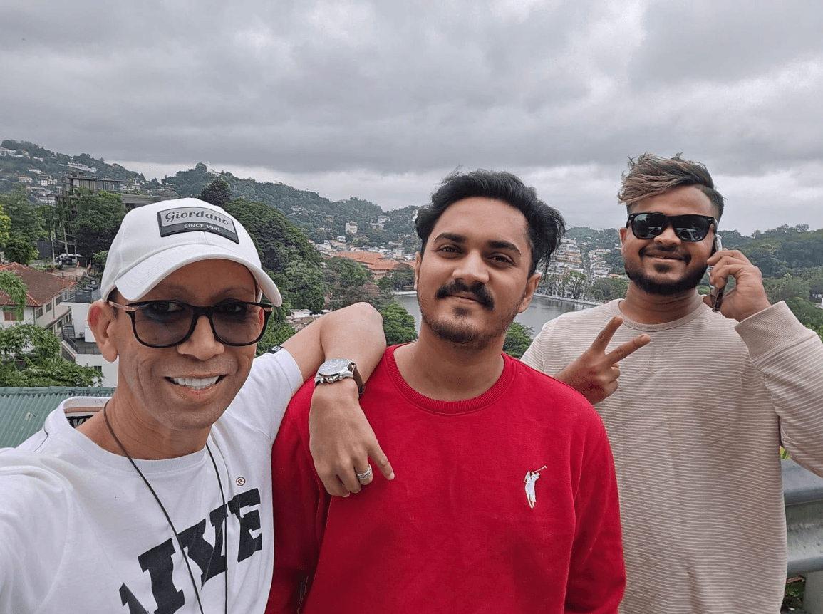 Guests overlooking panoramic Kandy Lake and city hills with chauffeur hosts