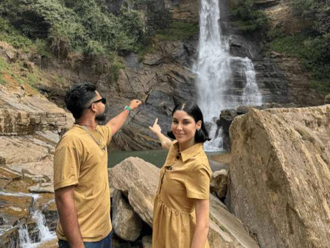Guests exploring cascading mountain waterfalls with private Tripvibe guide